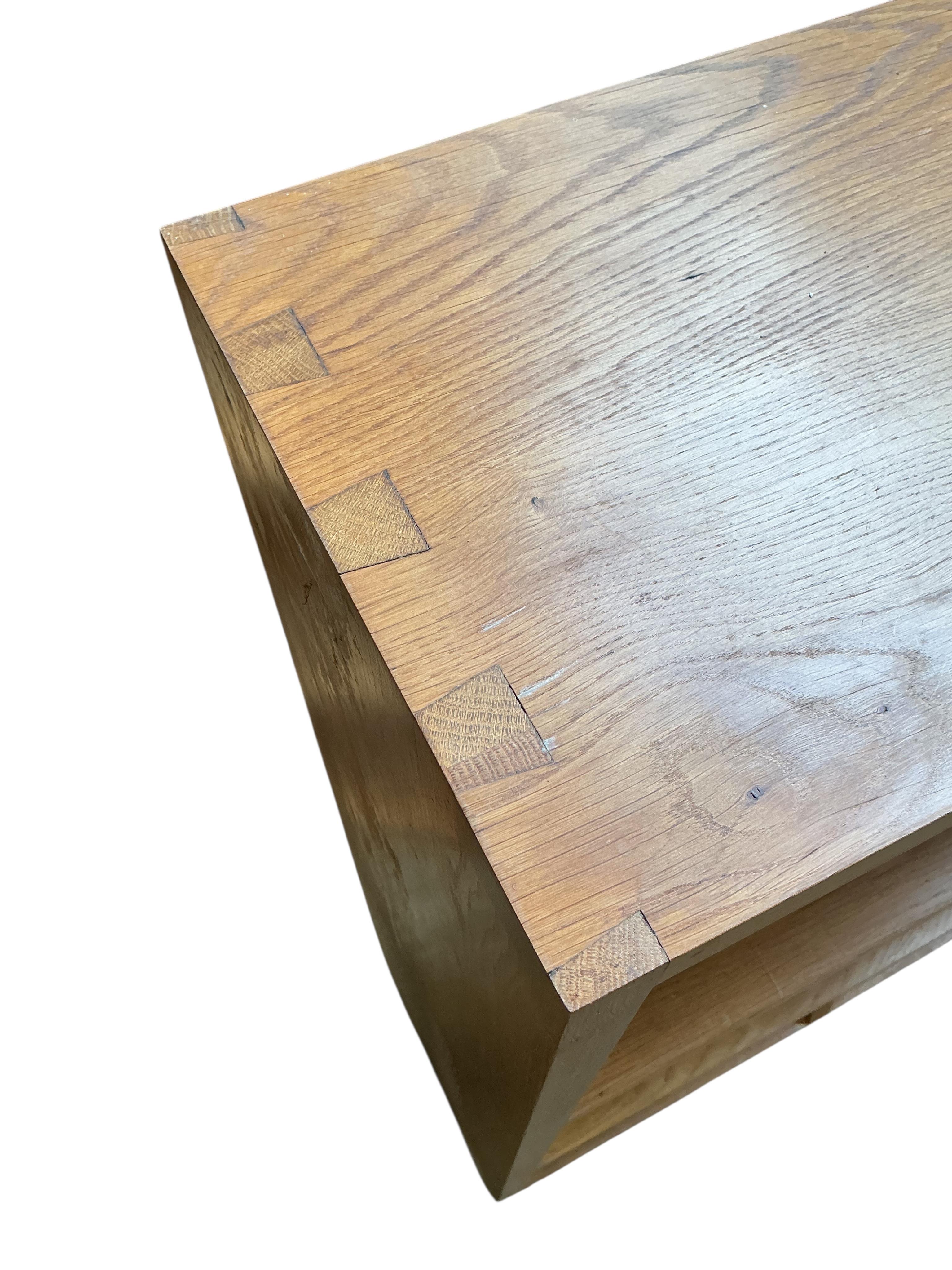 A pair of bespoke oak open bookcases, each width 132cm, depth 30cm, height 107cm